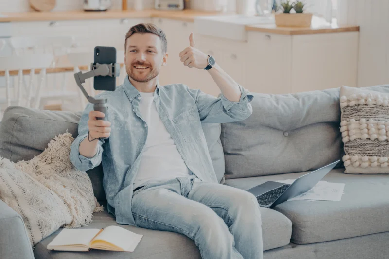 A happy client giving a thumbs up in a clean room