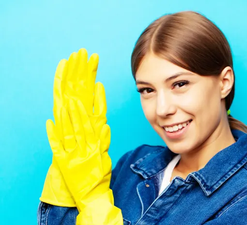 A smiling Choice Cleaning Plus cleaner in yellow gloves ready to start a job