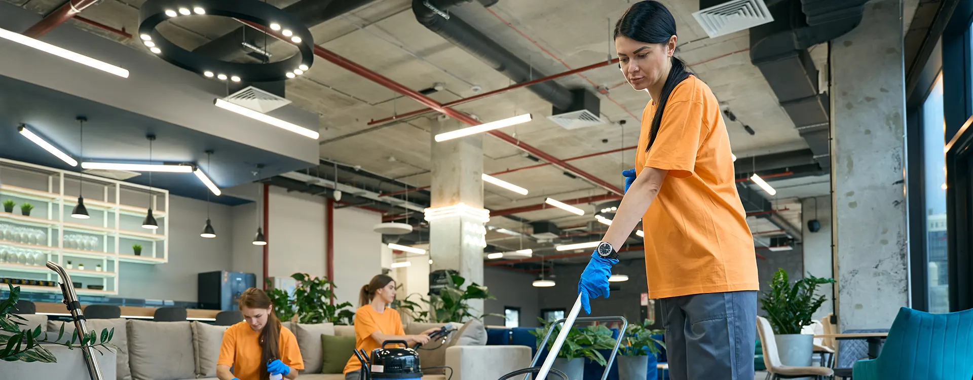A Choice Cleaning Plus team cleaning a restaurant interior
