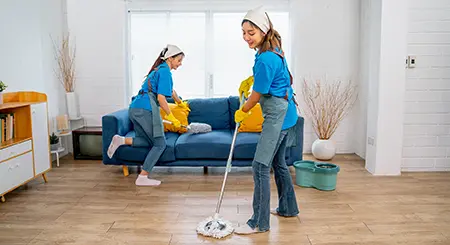 Crew cleaning a living room