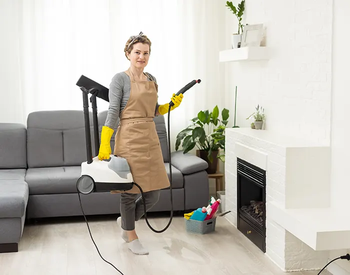 A Choice Cleaning Plus cleaner with a steam cleaning machine in a modern rental living room