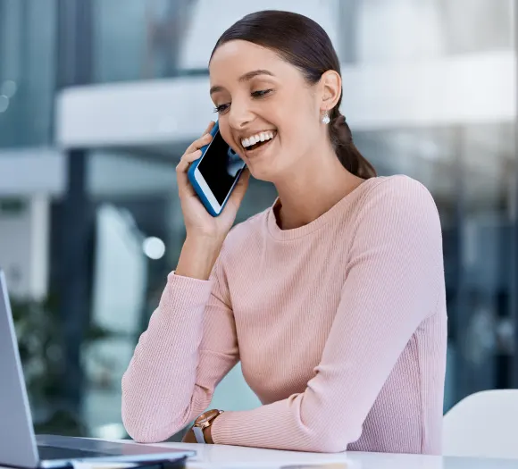 A friendly Choice Cleaning Plus representative on a call at her laptop