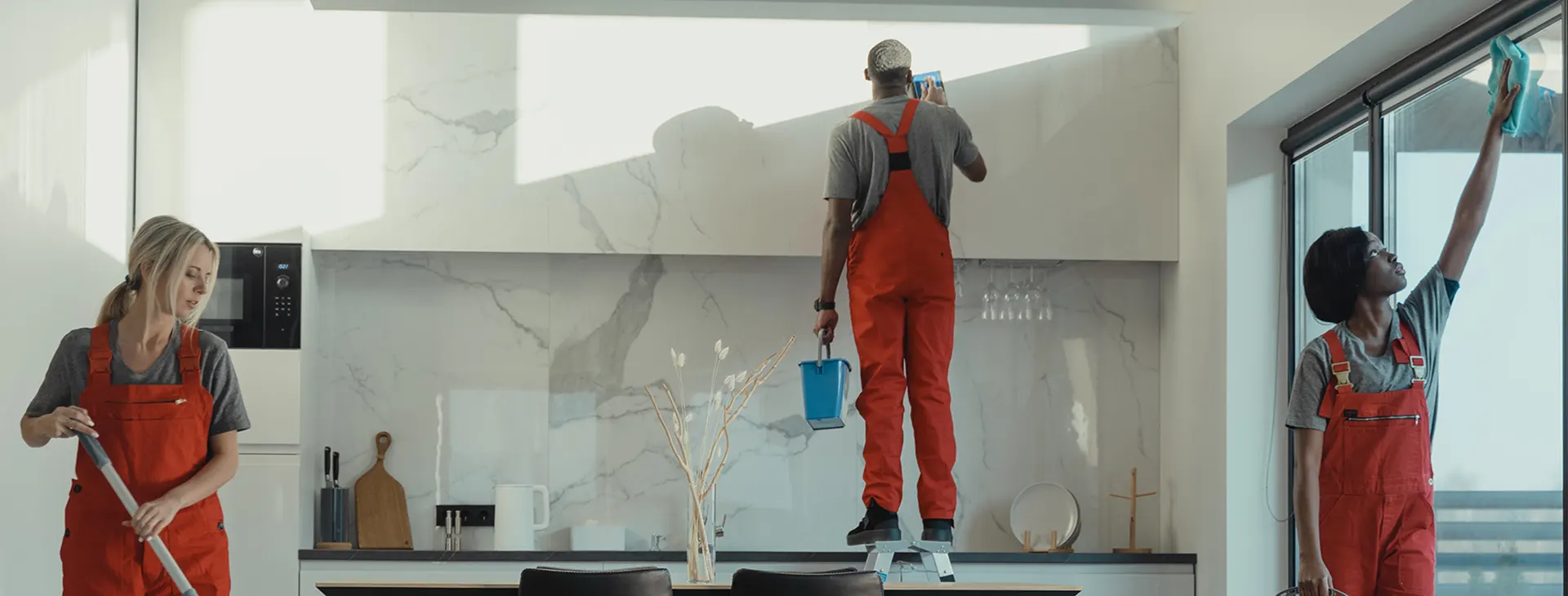 A Choice Cleaning Plus crew cleaning a bright modern kitchen