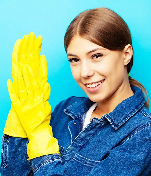 A smiling cleaner in yellow gloves